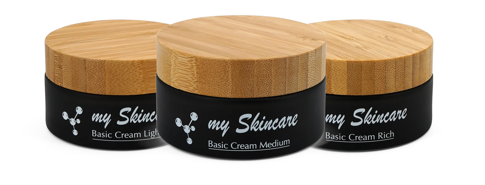 Die Basic Creams Light, Medium und Rich in schwarzen Tiegeln mit Holzdeckeln